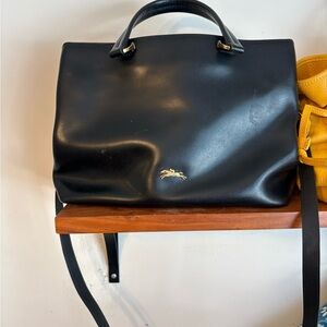 Black Leather Longchamp Handbag with Gold Logo